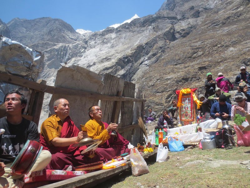 Lamas recite holy scripts while praying for the departed soul at the ruins of 600-year-old stupa at Langtang of Rasuwa district while marking the first annivesary of April 25 earthquake. A Memorial Mani Wall has been constructed at the site with name of 175 locals and 41 foreigners who were killed in Langtang village after an quake-triggered avalanche hit the village. Photo: Keshav P Koirala