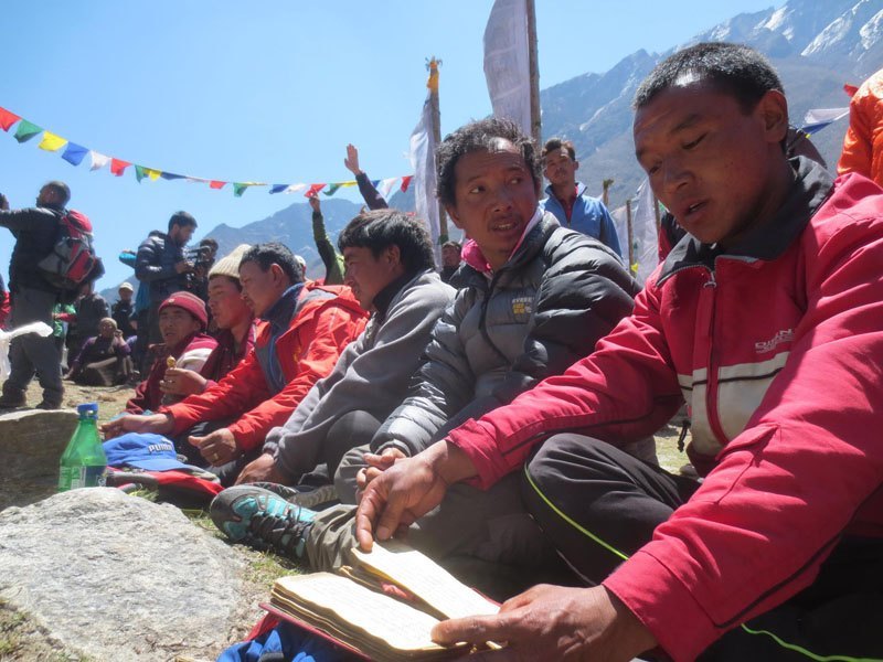 People observe silence at the ruins of 600-year-old stupa at Langtang of Rasuwa district while marking the first annivesary of April 25 earthquake. A Memorial Mani Wall has been constructed at the site with name of 175 locals and 41 foreigners who were killed in Langtang village after an quake-triggered avalanche hit the village. Photo: Keshav P Koirala/THT